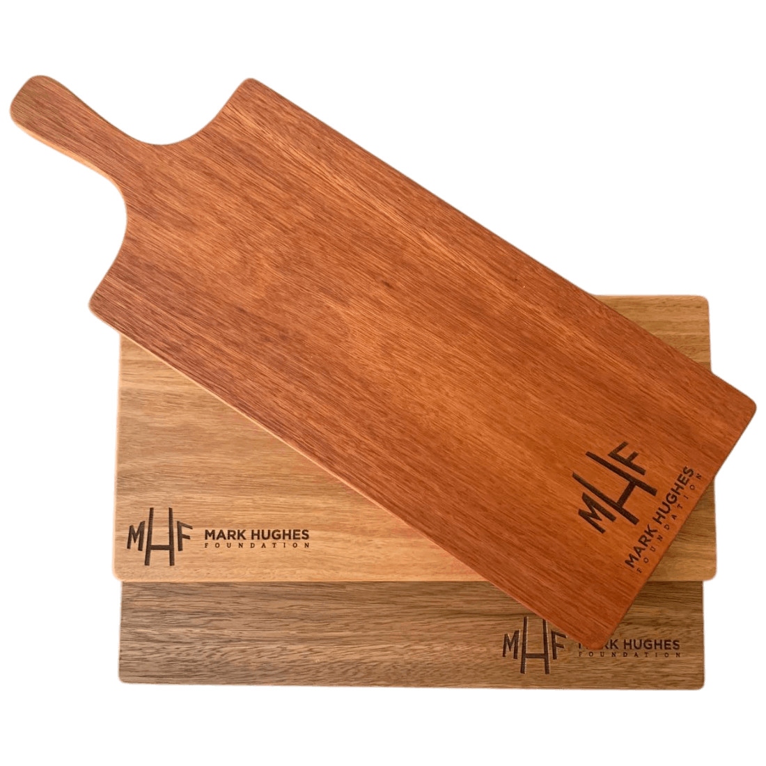 A selection of custom engraved corporate gift boards for the Mark Hughes Foundation