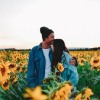 Testimonial profile picture of a couple in a field of flowers